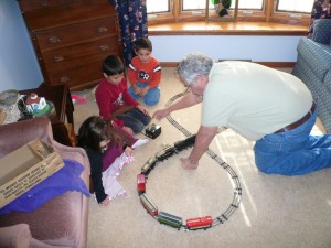 Grandpa Tom sets up a train for us
